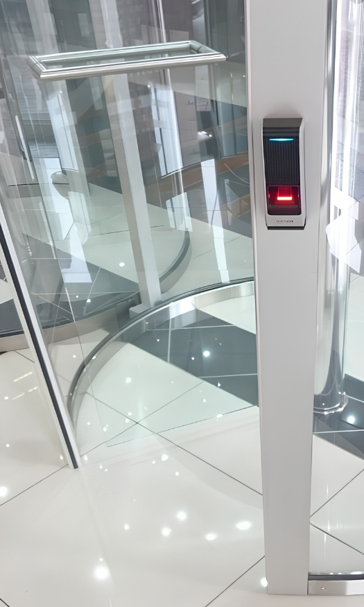 Biometric access reader integrated with a glass security revolving door
